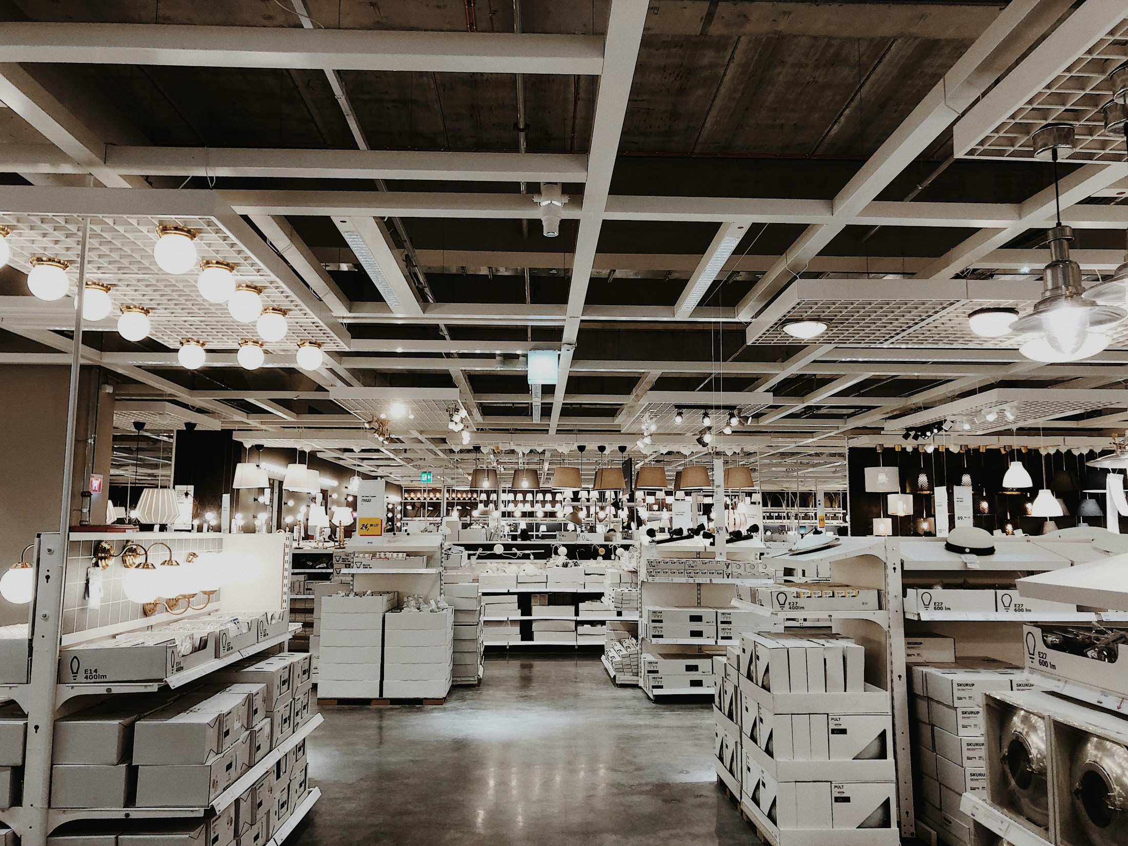 Appliance showroom with rows of white home appliances