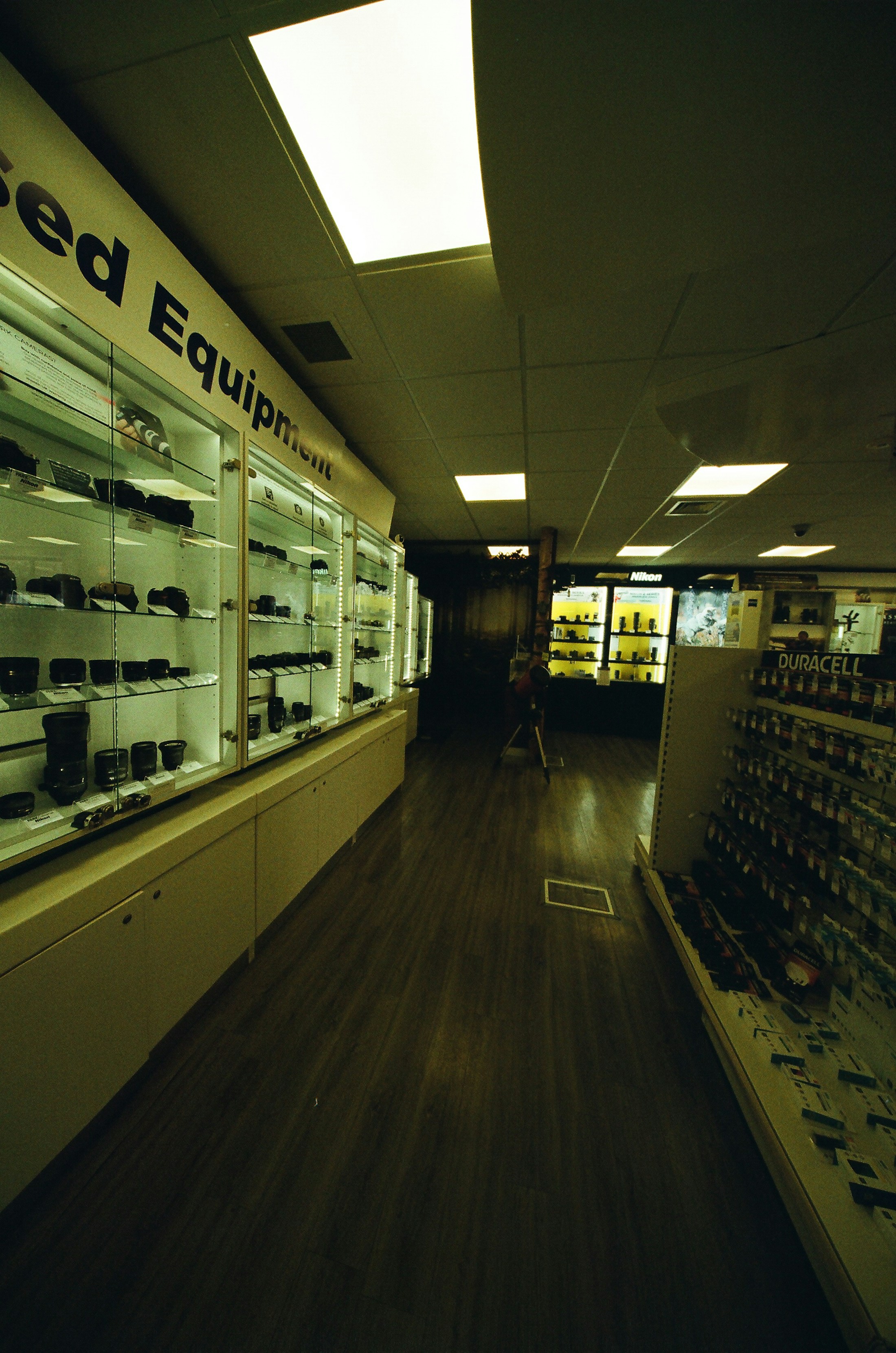 Retail display cases with consumer electronics and camera equipment