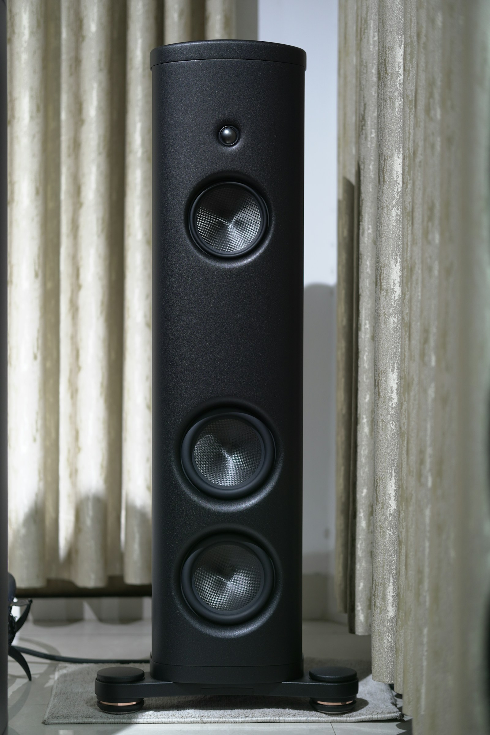 Tall black home audio speaker